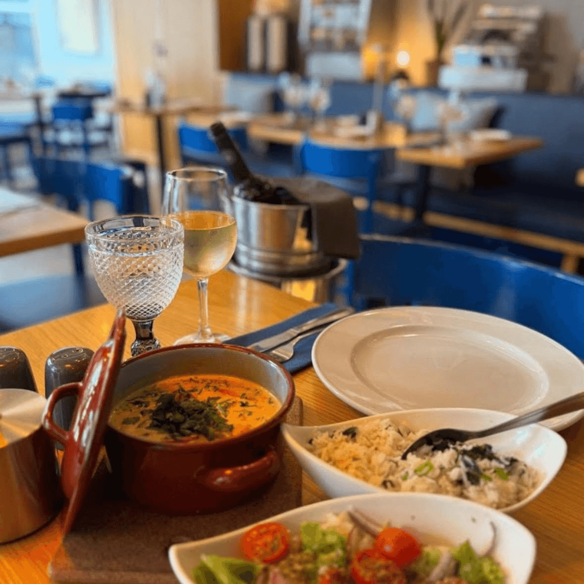 Portuguese dishes served at a table inside Leitaria da Anunciada