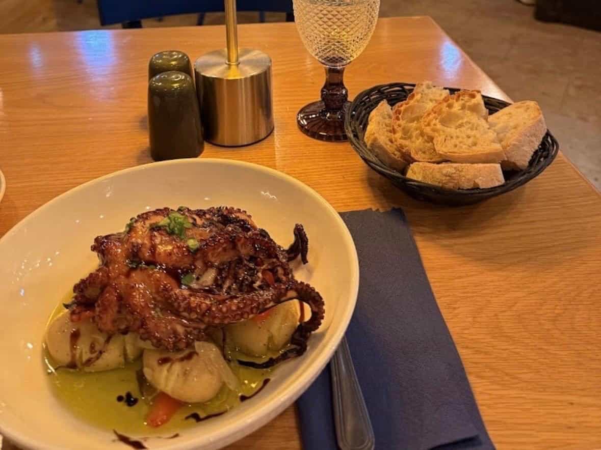 Octopus lagareiro with roasted potatoes and onion